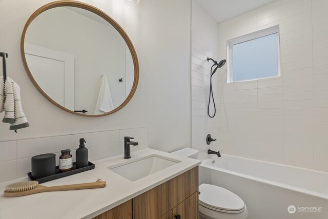 full bathroom with shower / bath combination, tasteful backsplash, toilet, and vanity