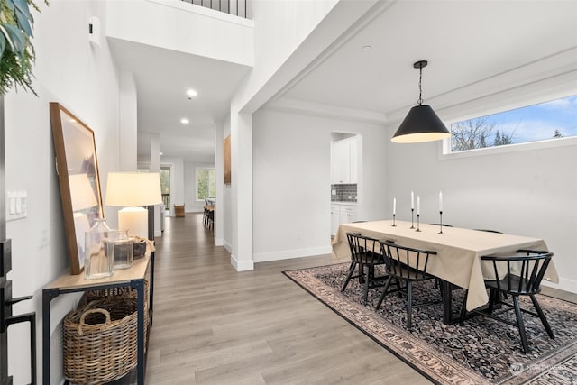 dining space featuring light wood-type flooring