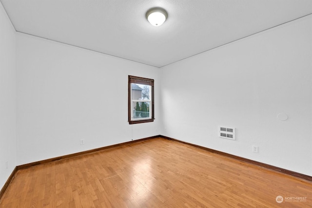 unfurnished room featuring wood-type flooring