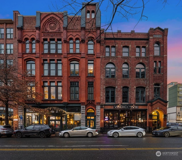 view of outdoor building at dusk