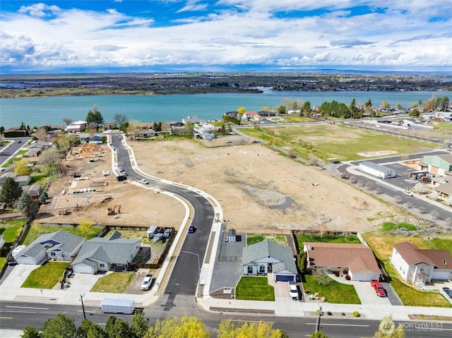 aerial view featuring a residential view and a water view