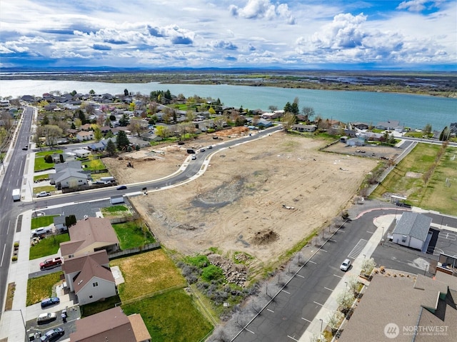 aerial view featuring a water view and a residential view