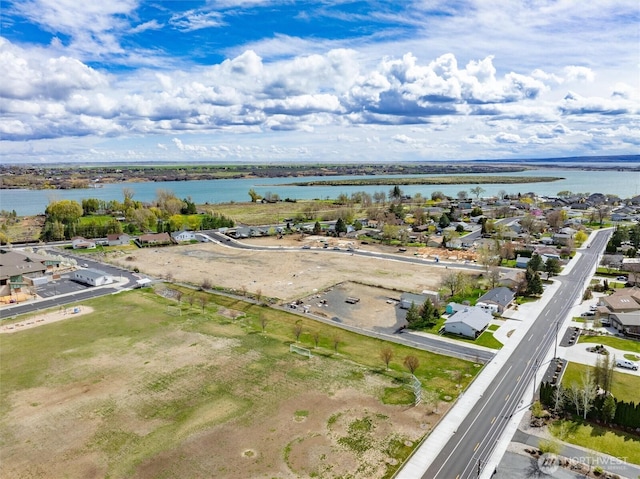 bird's eye view featuring a water view and a residential view
