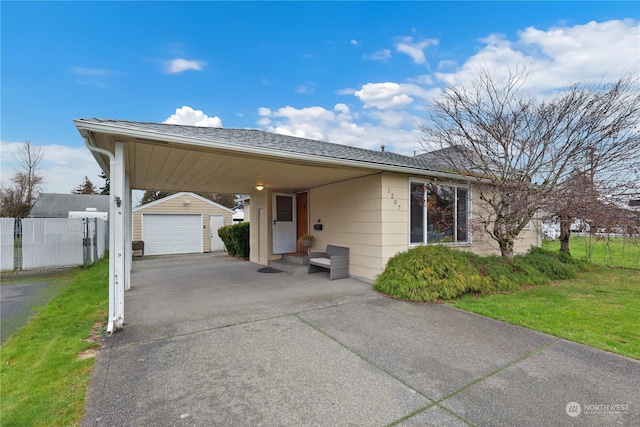 view of front of house featuring a carport, a garage, an outdoor structure, and a front lawn