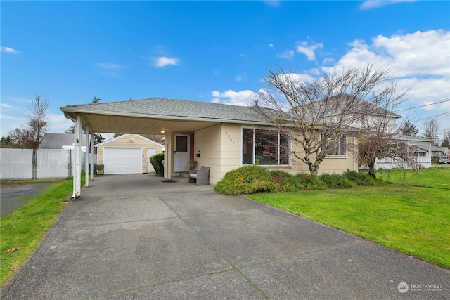 1207 W Pioneer, Puyallup, WA 98371 - view of front of property featuring a garage, an outbuilding, and a front yard