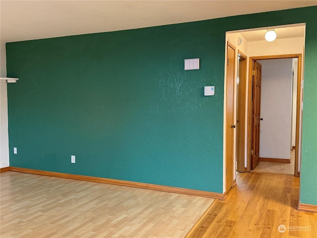 empty room with light wood-type flooring