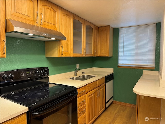 kitchen featuring light wood-type flooring, electric range, white dishwasher, and sink