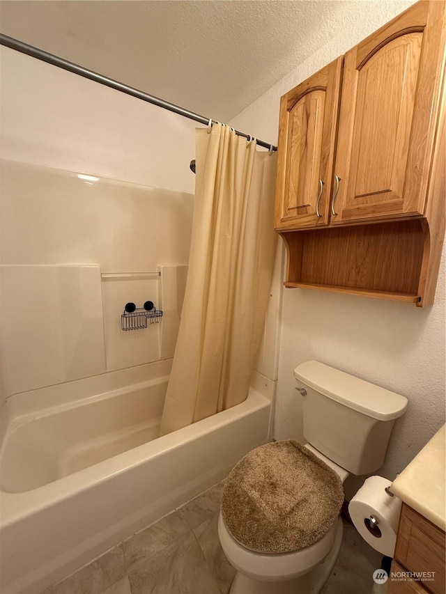 bathroom with shower / bath combo, a textured ceiling, and toilet