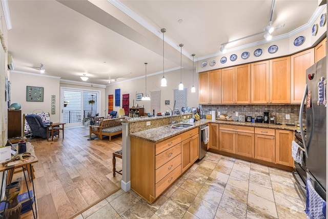 kitchen featuring stainless steel dishwasher, refrigerator, kitchen peninsula, and pendant lighting