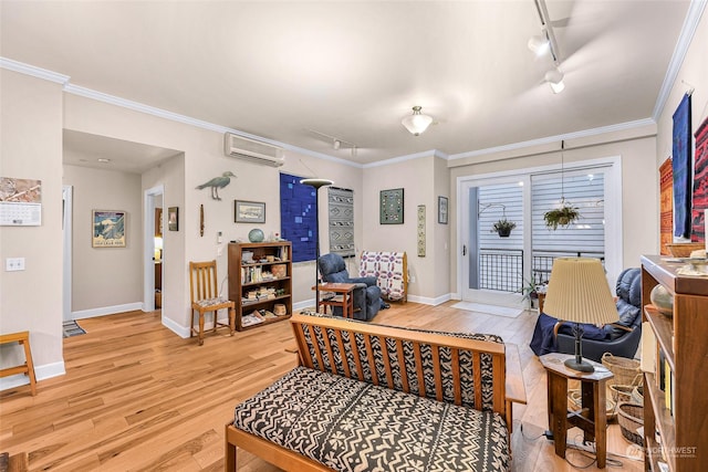 1101 Mckenzie Ave Unit 206, Bellingham, WA 98225 - living room featuring track lighting, light wood finished floors, a wall mounted air conditioner, and crown molding