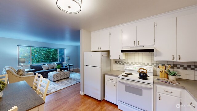 kitchen with white cabinets, decorative backsplash, white appliances, and light wood-type flooring