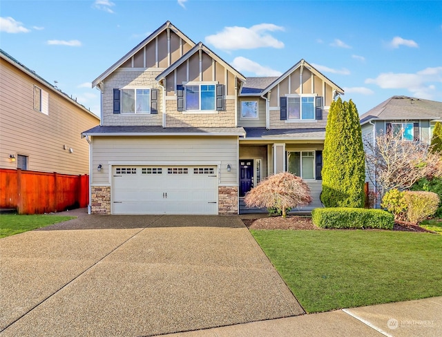 view of front of home featuring a front yard and a garage