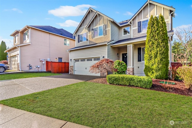 view of front of home featuring a garage and a front lawn