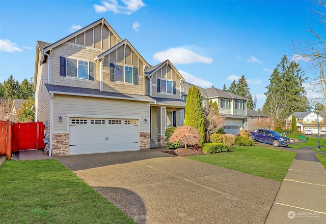 view of front of home with a front yard and a garage