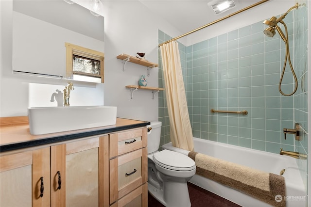 full bathroom with shower / bathtub combination with curtain, vanity, and toilet