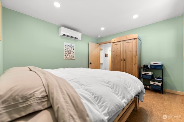 carpeted bedroom with a wall unit AC