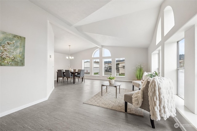 living room featuring a notable chandelier, lofted ceiling with beams, and dark hardwood / wood-style flooring