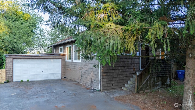 view of side of home with a garage