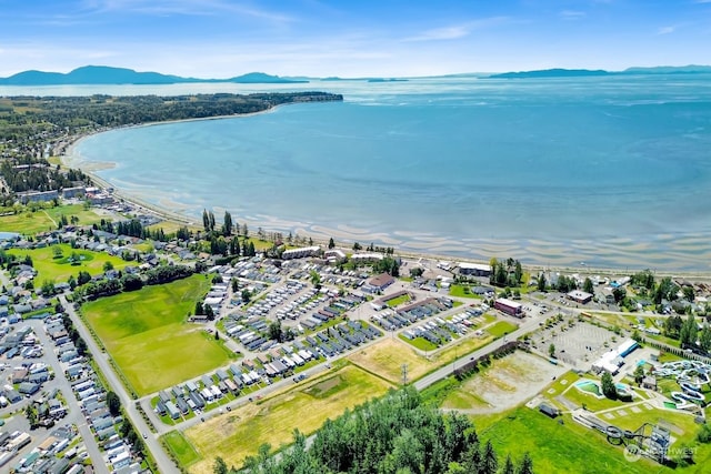 aerial view featuring a water and mountain view