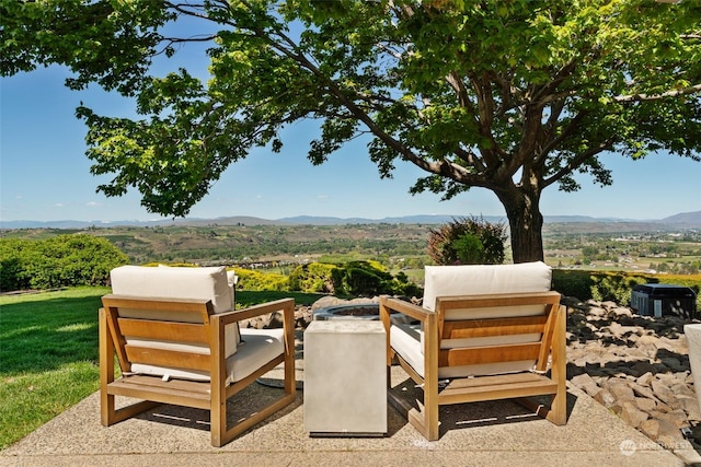 view of patio / terrace featuring a mountain view