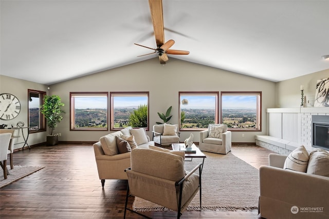 living room featuring a fireplace, vaulted ceiling with beams, ceiling fan, and dark wood-type flooring