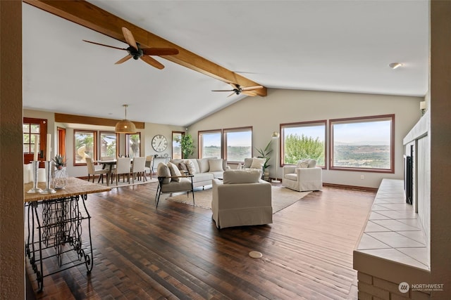 living room featuring lofted ceiling with beams, ceiling fan, and wood-type flooring