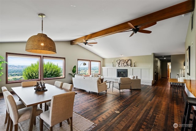 dining area featuring ceiling fan, dark wood-type flooring, and lofted ceiling with beams