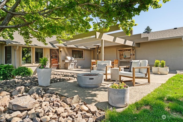 view of patio with a pergola, an outdoor fire pit, and a grill