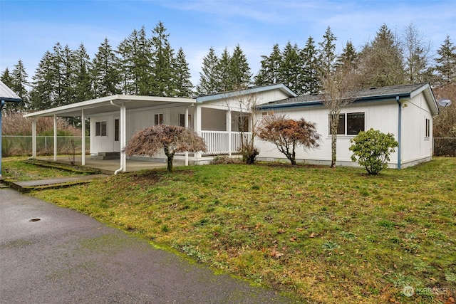 view of front of home with a porch and a front yard