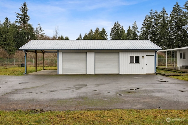 garage featuring a carport