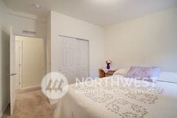 carpeted bedroom with a closet