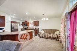 interior space with vaulted ceiling and a chandelier