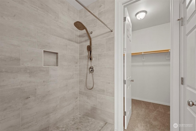 bathroom with tiled shower