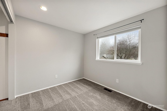 unfurnished room featuring carpet flooring