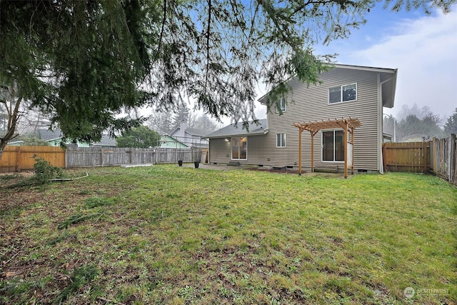 rear view of property with a yard and a pergola