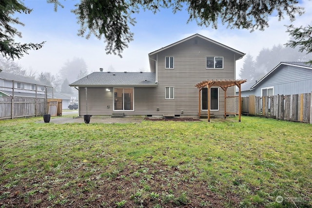 back of property with a yard and a pergola