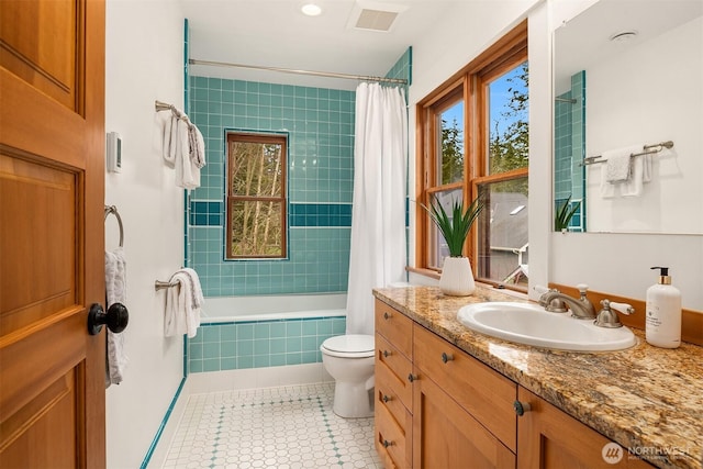 full bathroom with shower / bathtub combination with curtain, vanity, toilet, and tile patterned floors