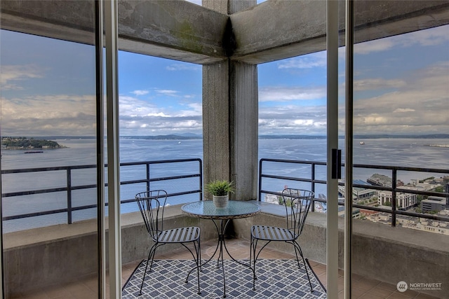 sunroom / solarium with a water view