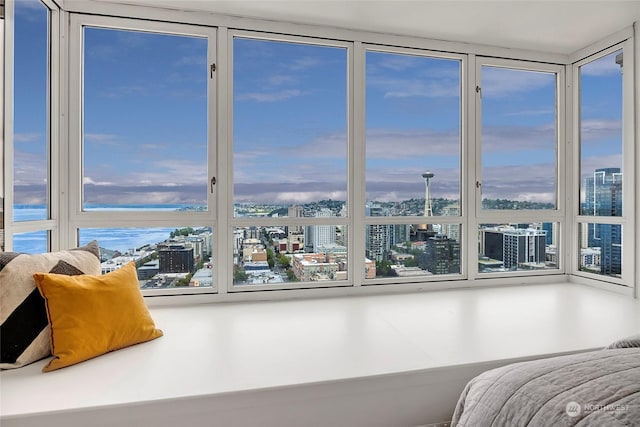 bedroom with multiple windows and expansive windows