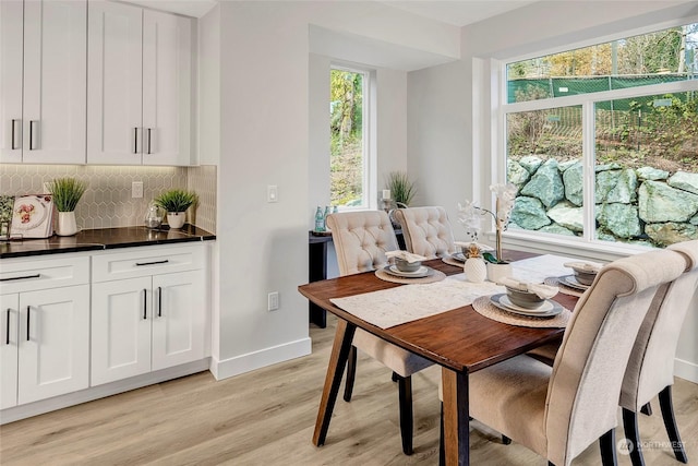 dining area featuring light wood-type flooring