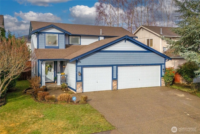 traditional-style house featuring roof with shingles, an attached garage, a front yard, stone siding, and driveway