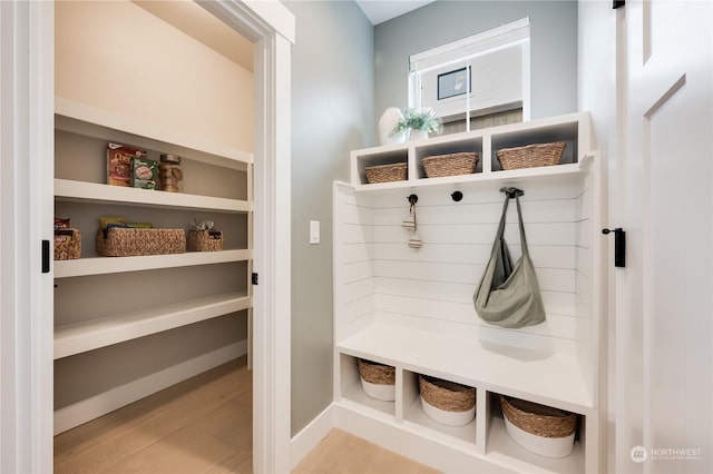 mudroom with light hardwood / wood-style floors