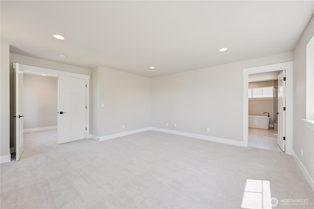 26521 NE 147th Pl Unit Sr 11, Duvall, WA 98019 - unfurnished room with light colored carpet, recessed lighting, baseboards, and a smoke detector