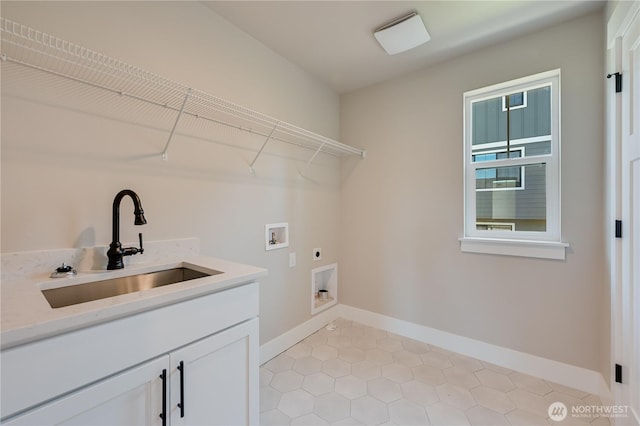 26521 NE 147th Pl Unit Sr 11, Duvall, WA 98019 - laundry area featuring electric dryer hookup, washer hookup, baseboards, light tile patterned floors, and cabinet space
