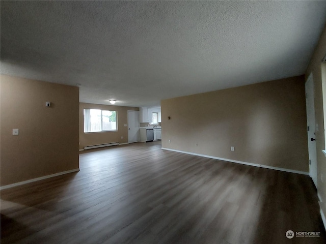 unfurnished living room featuring a textured ceiling, dark wood-type flooring, and a baseboard heating unit