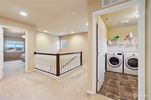 laundry area featuring washer and dryer and dark carpet