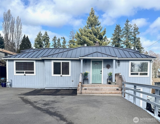 view of front of home with metal roof and a standing seam roof