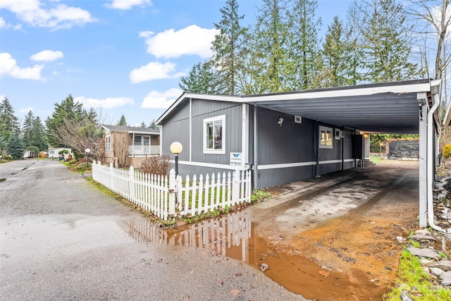 view of home's exterior featuring a carport