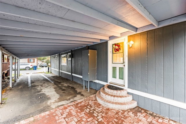 property entrance featuring a carport