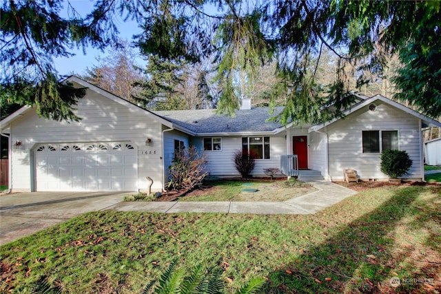 ranch-style house featuring a front yard and a garage